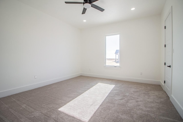 carpeted empty room with ceiling fan