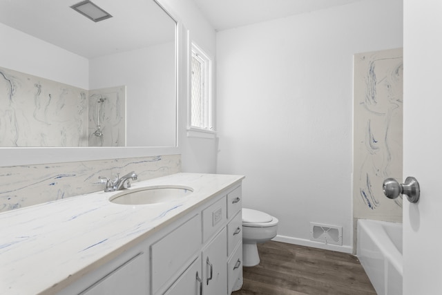 4635 30th St, Lubbock, TX 79410 - full bath featuring vanity, wood finished floors, and tub / shower combination