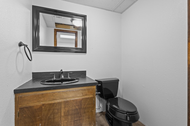 4635 30th St, Lubbock, TX 79410 - bathroom featuring vanity and wood finished floors