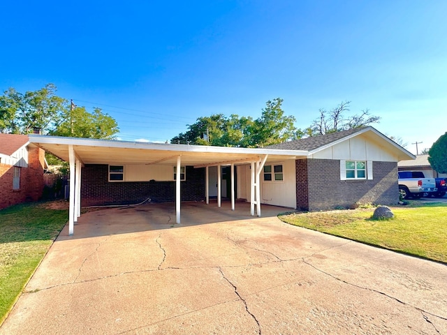 ranch-style house featuring a front yard and a carport