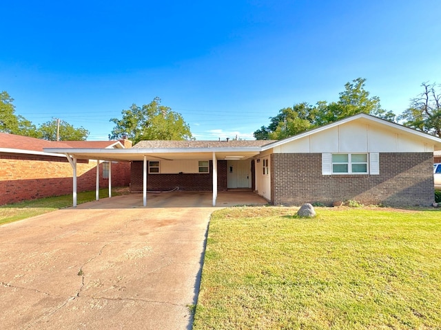 single story home featuring a front yard and a carport