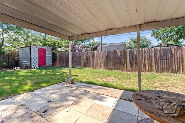 view of patio / terrace featuring a storage unit