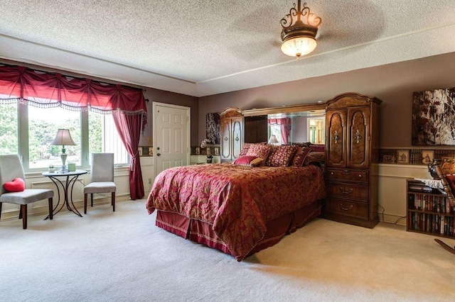 carpeted bedroom with a textured ceiling