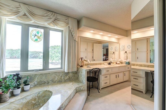 bathroom featuring vanity and a textured ceiling