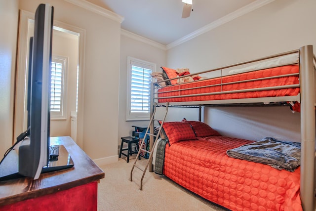 bedroom with crown molding, ceiling fan, and light carpet