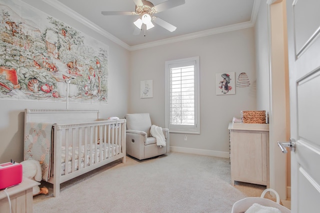 bedroom featuring crown molding, light colored carpet, a nursery area, and ceiling fan