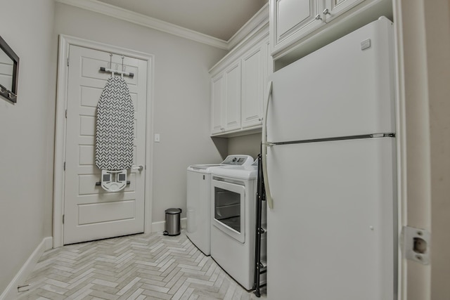 clothes washing area featuring light parquet flooring, ornamental molding, cabinets, and washing machine and clothes dryer