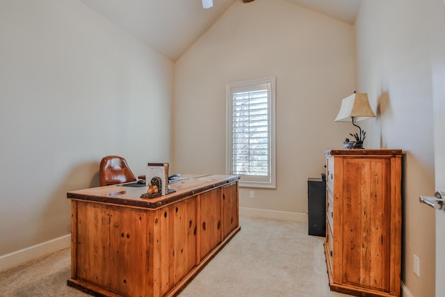 home office featuring lofted ceiling and light carpet