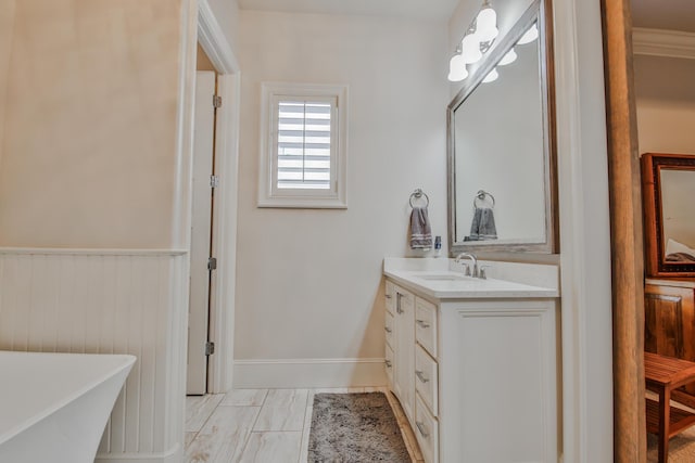 bathroom with vanity and a tub