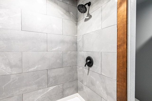 room details with a tile shower