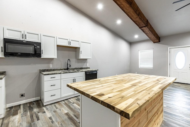 kitchen featuring sink, beamed ceiling, black appliances, and white cabinets