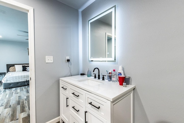 bathroom featuring vanity and hardwood / wood-style floors