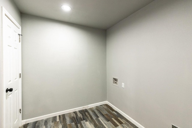 washroom with hookup for a washing machine and dark wood-type flooring