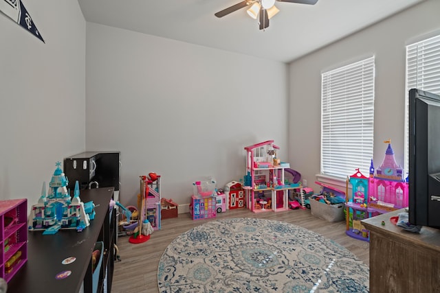 playroom featuring wood finished floors and a ceiling fan