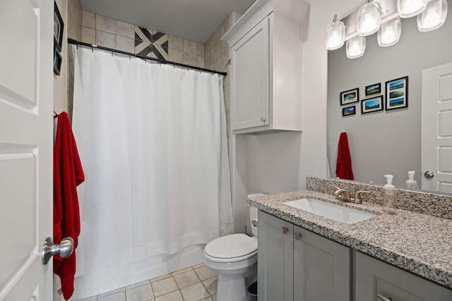 full bath with vanity, toilet, tile patterned flooring, and shower / tub combo with curtain