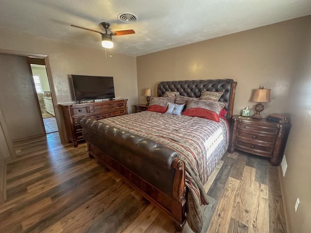 bedroom with a ceiling fan, visible vents, and wood finished floors