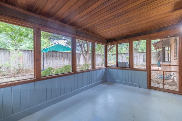 unfurnished sunroom featuring wood ceiling