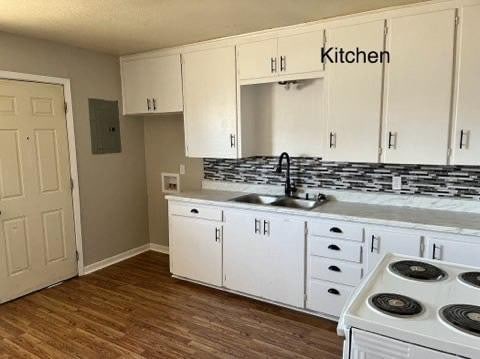 kitchen with sink, electric panel, white cabinets, and white electric range oven