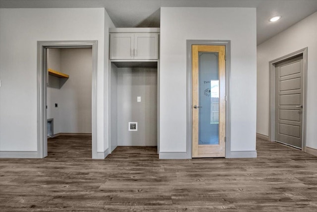 interior space with white cabinetry and dark hardwood / wood-style floors