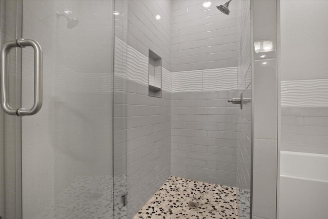 bathroom featuring an enclosed shower