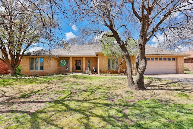 ranch-style home with a garage and a front lawn