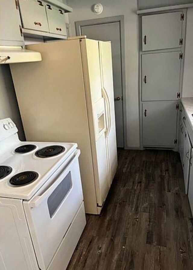 kitchen with white cabinetry, dark wood-type flooring, exhaust hood, and white range with electric cooktop