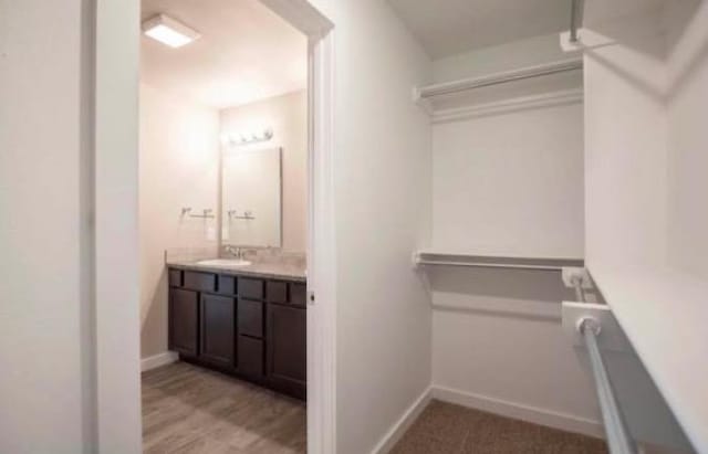 walk in closet with sink