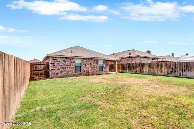 7024 34th Pl, Lubbock, TX 79407 - back of house with brick siding and roof with shingles