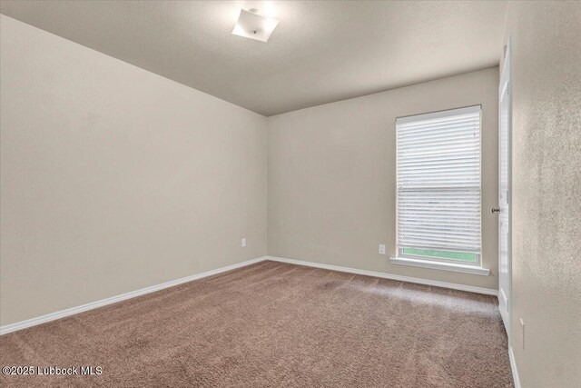 7024 34th Pl, Lubbock, TX 79407 - unfurnished room featuring carpet flooring and baseboards
