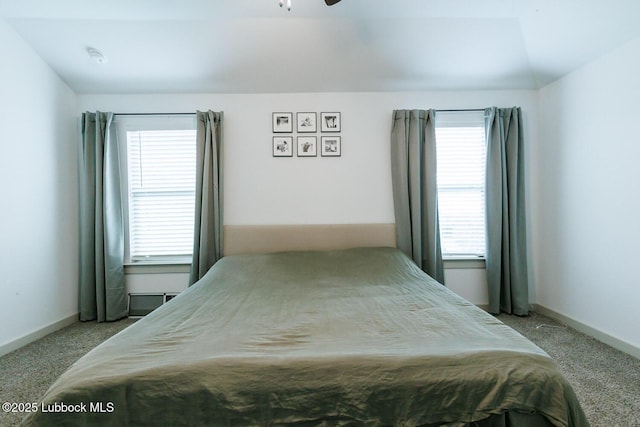 7415 8th St, Lubbock, TX 79416 - carpeted bedroom with multiple windows and baseboards