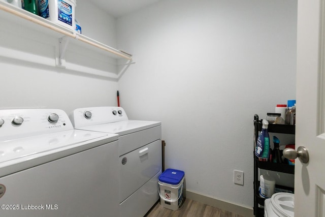 7415 8th St, Lubbock, TX 79416 - laundry area with independent washer and dryer, wood finished floors, and baseboards