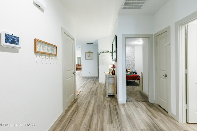 7415 8th St, Lubbock, TX 79416 - hallway featuring light wood-style flooring