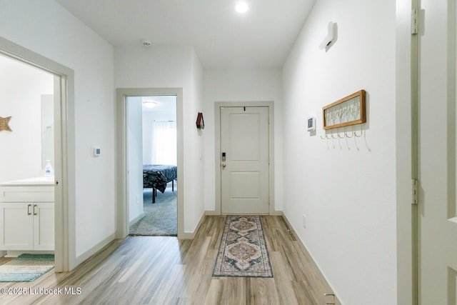 7415 8th St, Lubbock, TX 79416 - corridor featuring light wood-type flooring and baseboards