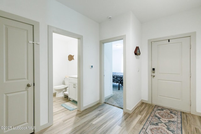 7415 8th St, Lubbock, TX 79416 - foyer featuring light wood finished floors and baseboards