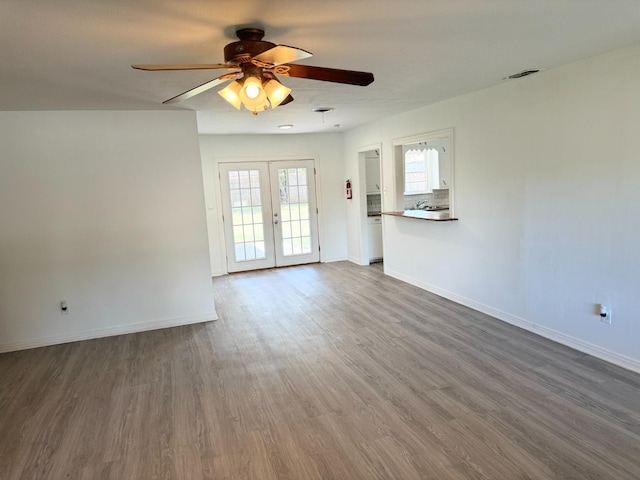 interior space featuring dark hardwood / wood-style floors, french doors, and ceiling fan