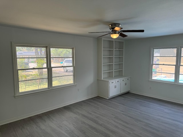 unfurnished room with hardwood / wood-style floors and ceiling fan