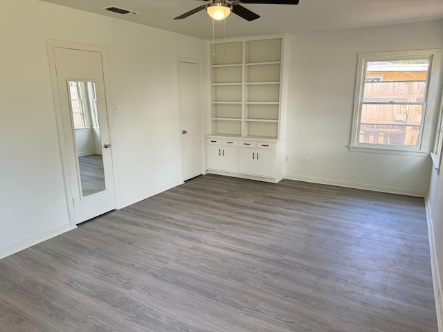 unfurnished bedroom with wood-type flooring and ceiling fan