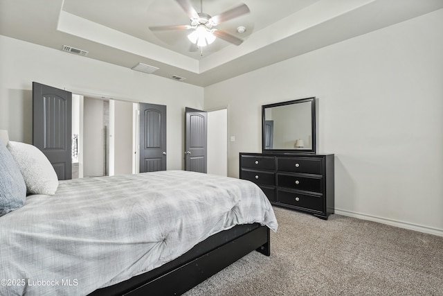 5303 Lehigh St, Lubbock, TX 79416 - bedroom with carpet flooring, a tray ceiling, baseboards, and ceiling fan