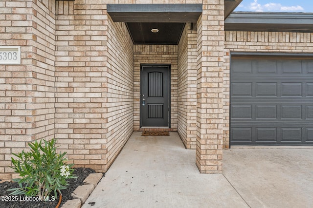 5303 Lehigh St, Lubbock, TX 79416 - entrance to property with an attached garage and brick siding