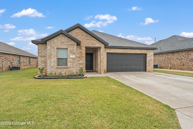 5303 Lehigh St, Lubbock, TX 79416 - view of front of house featuring concrete driveway, an attached garage, brick siding, a front lawn, and central air condition unit