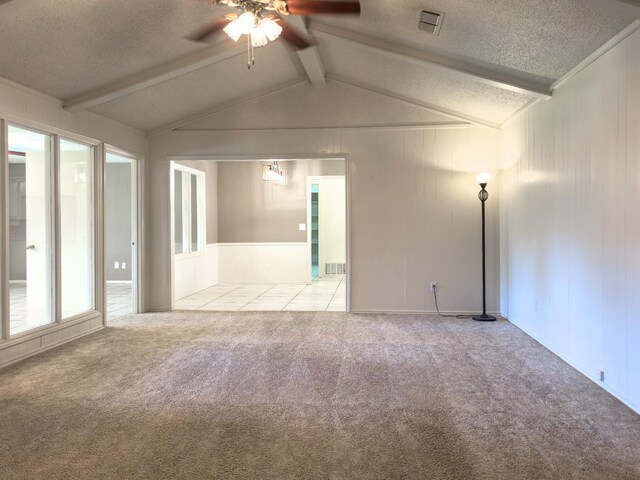 unfurnished room with ceiling fan, lofted ceiling with beams, light carpet, and a textured ceiling