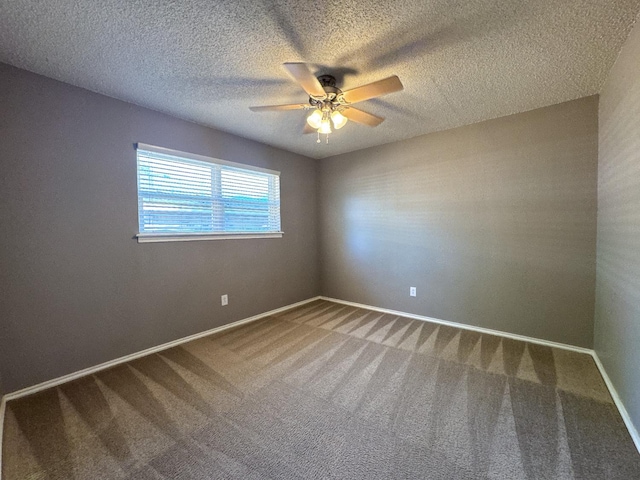 carpeted empty room featuring a textured ceiling and ceiling fan