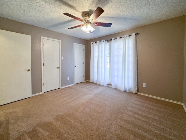 interior space featuring ceiling fan and a textured ceiling