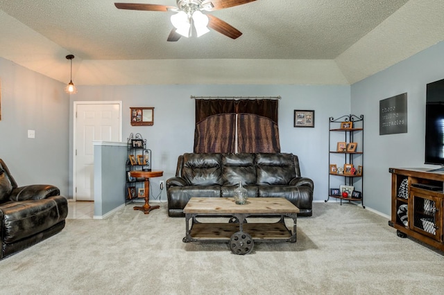 carpeted living room with ceiling fan, lofted ceiling, and a textured ceiling