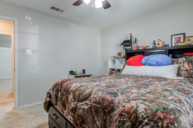 bedroom featuring light colored carpet and ceiling fan