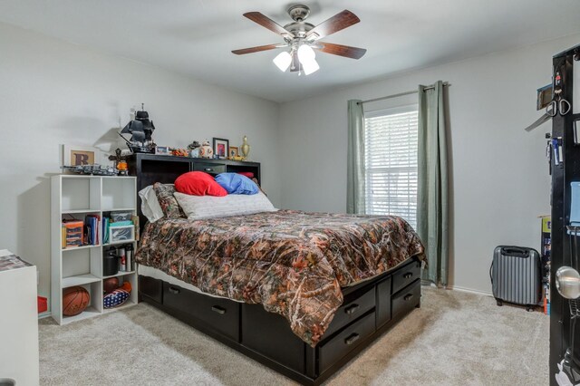 carpeted bedroom with ceiling fan