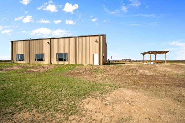 view of outdoor structure with a yard