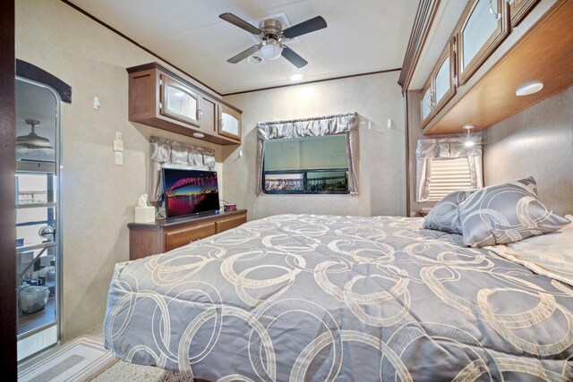 bedroom with a fireplace and ornamental molding