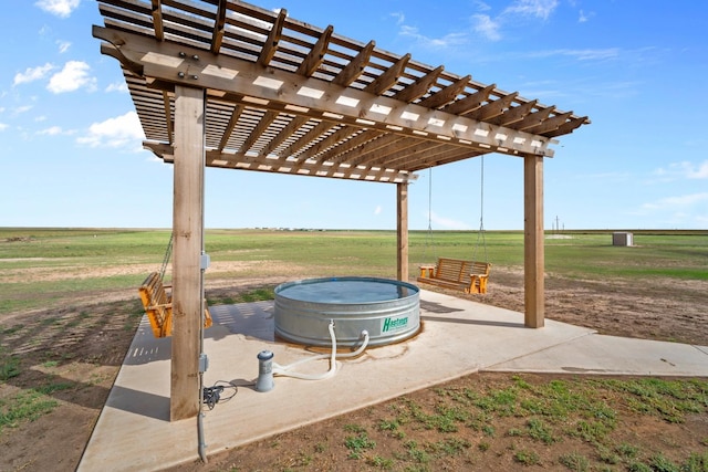 view of patio featuring a pergola and a rural view