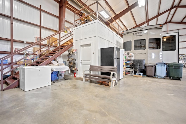 garage featuring refrigerator and stainless steel refrigerator